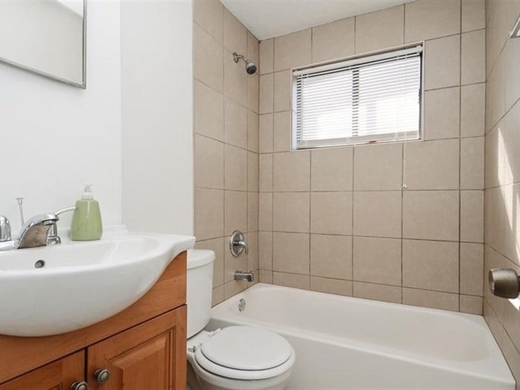 Updated bathroom finishes may be available at Pangea Vistas Apartments in Indianapolis.